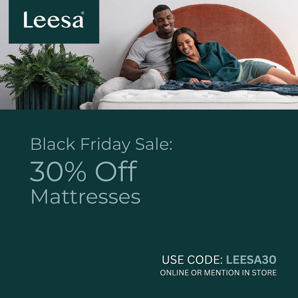 Couple lying on a Leesa mattress with Black Friday sale save 30% with code lessa30.  Or mention in store.